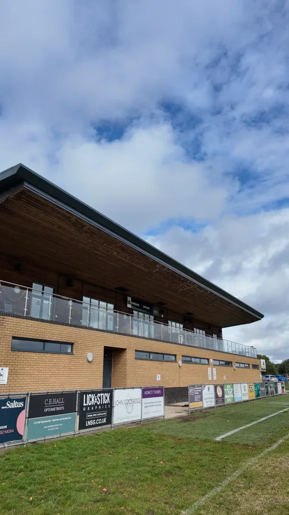 Balcony and deep roof overhang on the frontage of the Farnham Rugby Club clubhouse