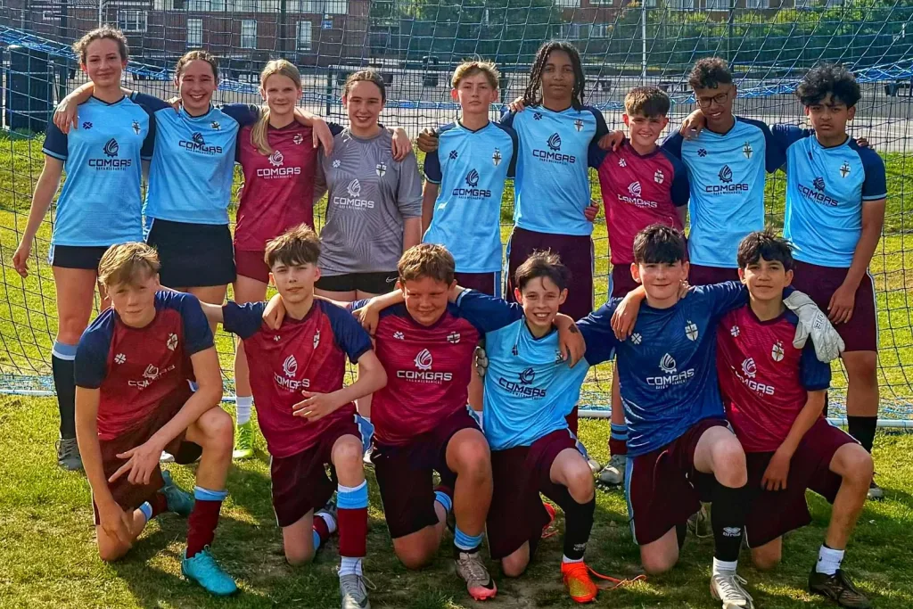 All Hallows School pupils wearing ComGas-sponsored team kit
