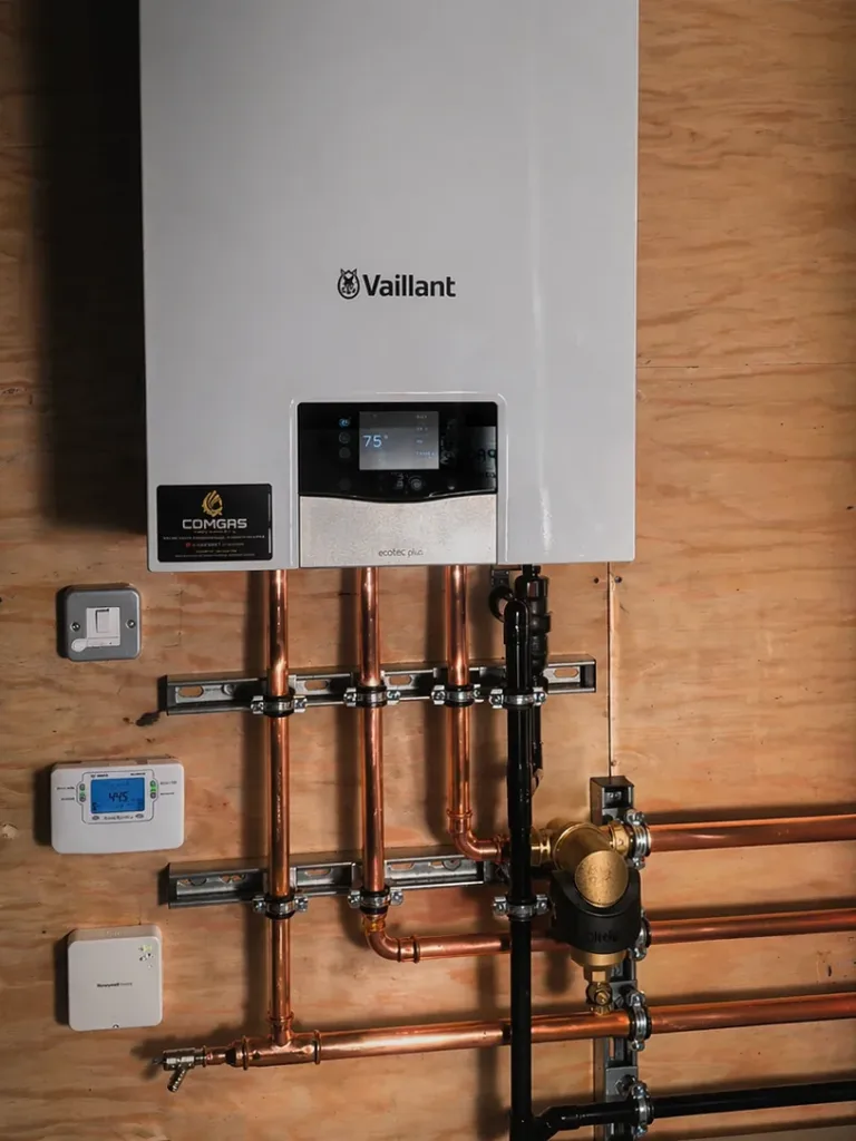 Vaillant ecoTEC Plus system boiler with new copper pipework, a magnetic filter and heating controls mounted alongside