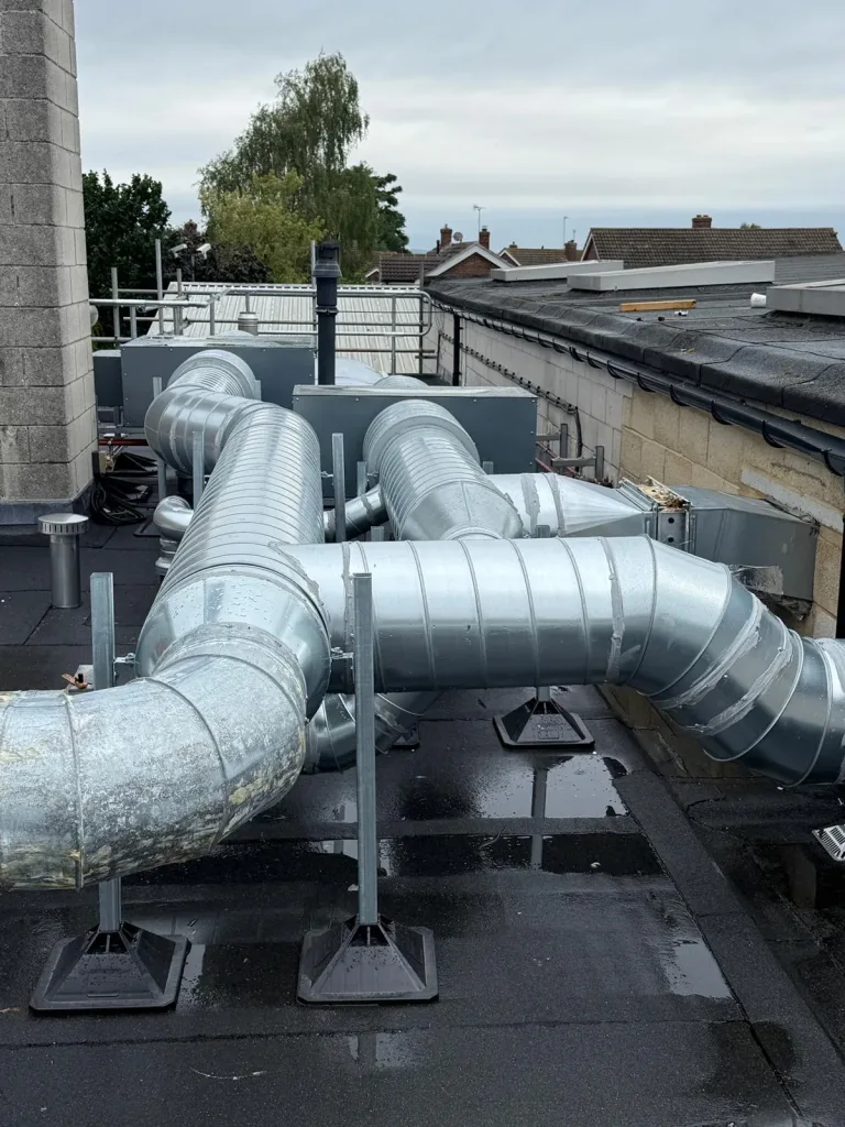 New and adapted galvanised ductwork routed across the roof at Didcot Ambulance Resource Centre