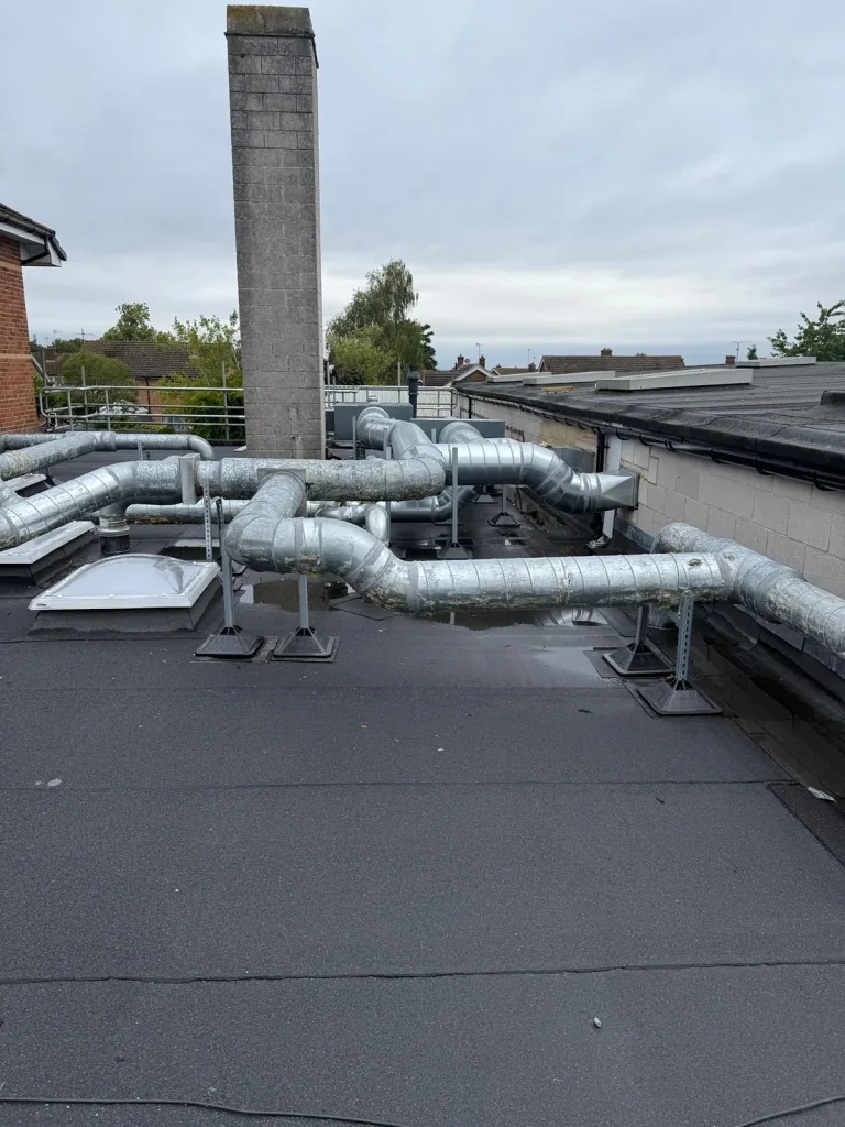 New galvanised ventilation ductwork during reinstatement at Didcot Ambulance Resource Centre