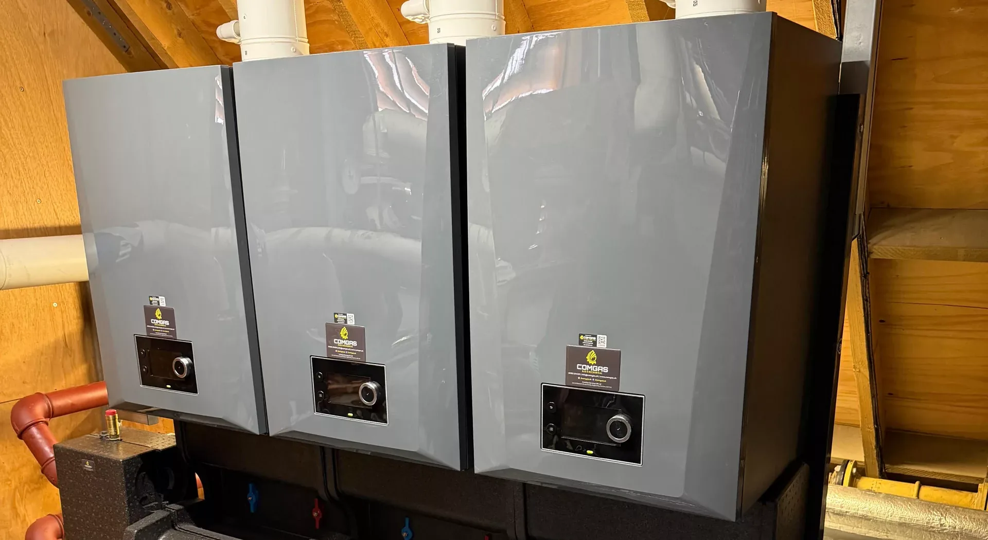 Wall-hung commercial condensing boiler cascade and flue headers installed at Hatch Mill Care Home, Farnham