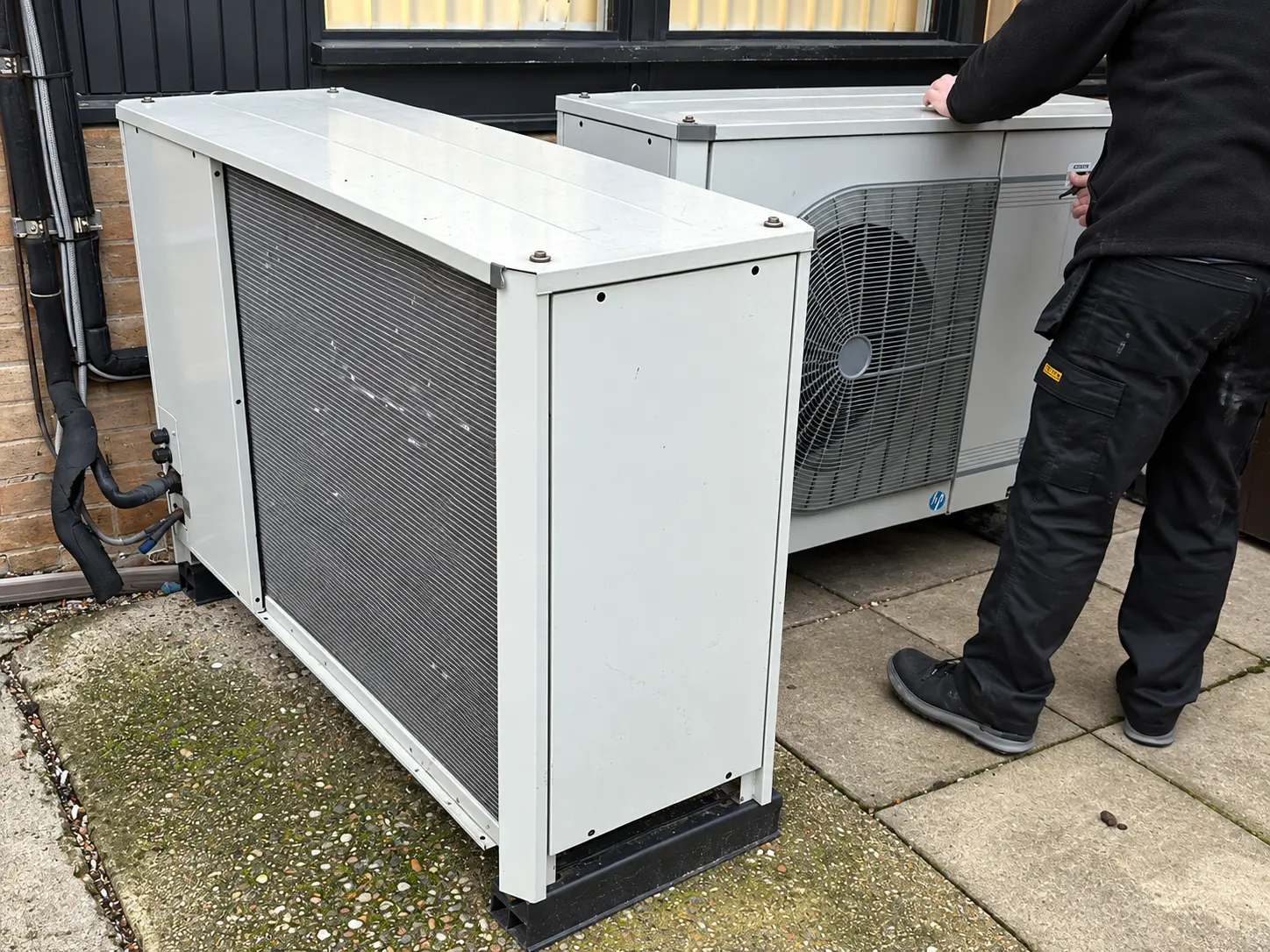 Outdoor condenser units during isolation and removal works.